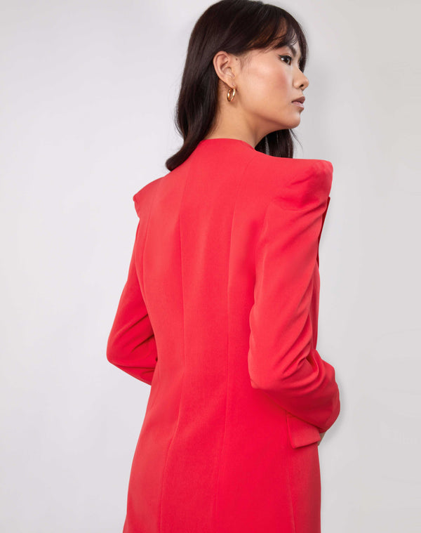 the model looks over her shoulder showing the back of the Quinn Red Double Breasted Blazer