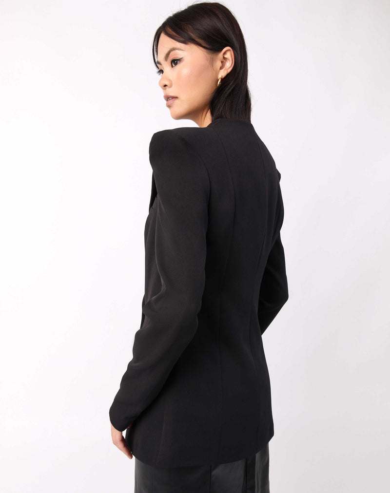 we see the back of the Quinn Black Double Breasted Blazer worn with a PU dress