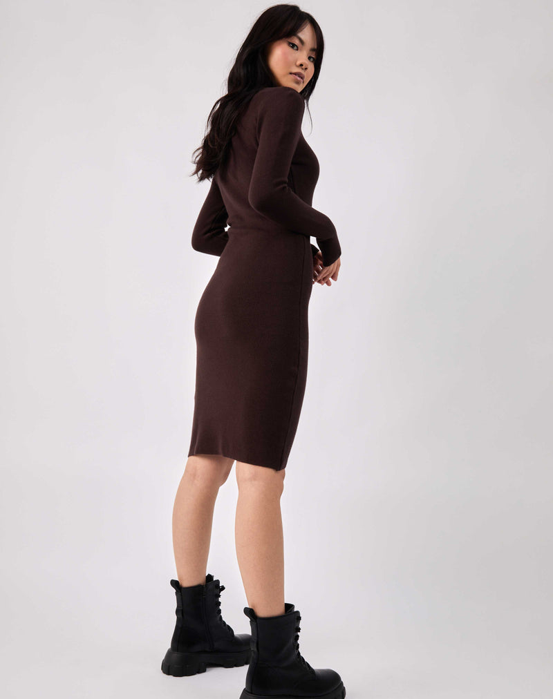 the model shows the back of the dress in the liana brown roll neck knit midi dress with military boots