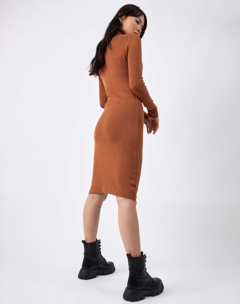 model poses from the back in the liana camel roll neck knit midi dress