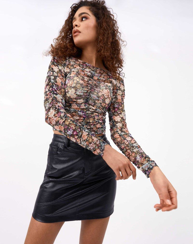 the model moves her hands in front of herself wearing the Rita Floral Ruched Mesh Top and pu skirt