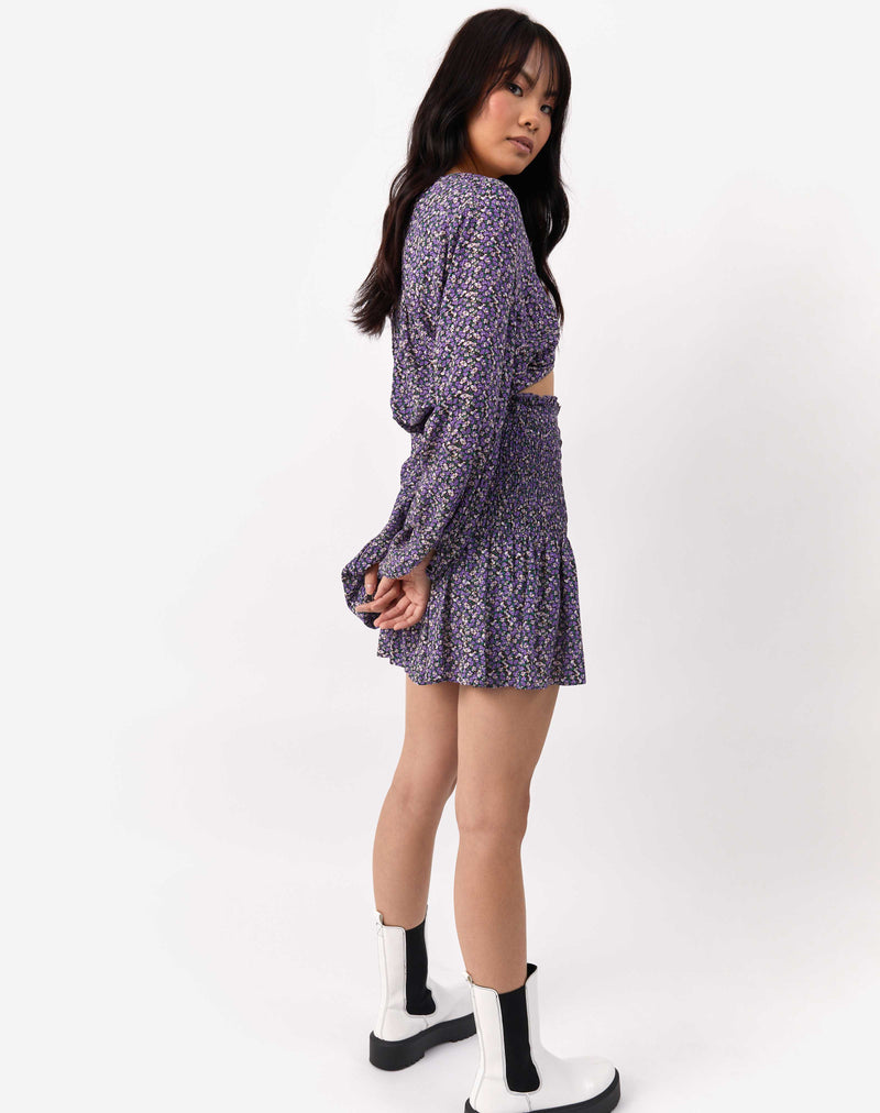 the model is turned to the side wearing the Una Shirred Skirt in Lilac Floral