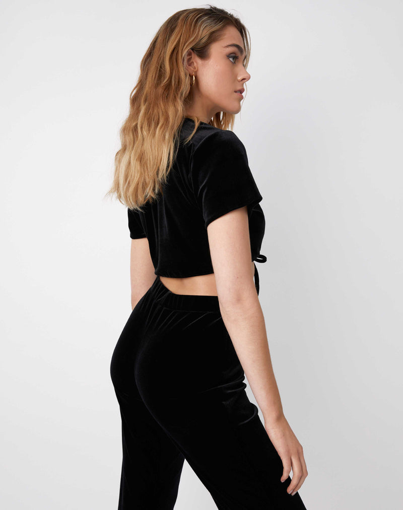 model turns to the side to show the Miley Black Velvet Tie Crop Top