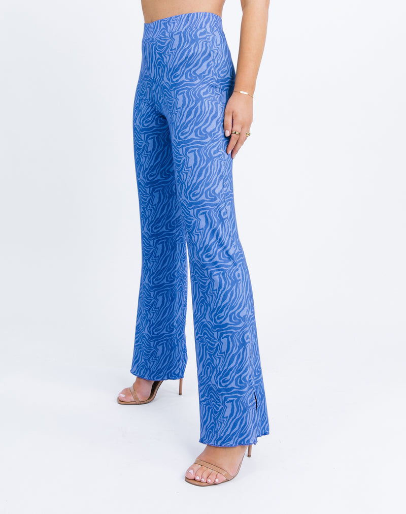 a close up side image of the model wearing the Ariana High Wasited Trousers in Blue Zebra