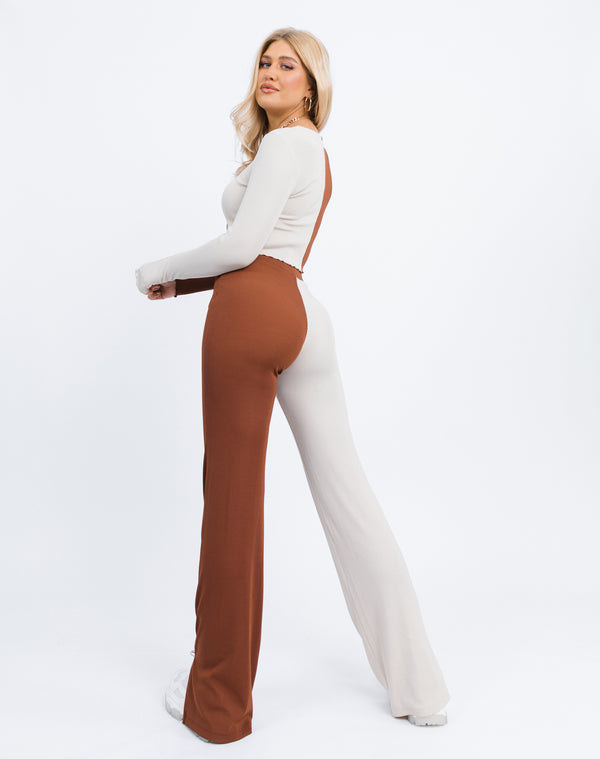 the model faces away from the camera showing the back of the Lana Wide Leg Trousers in Two Tone Rib and matching top