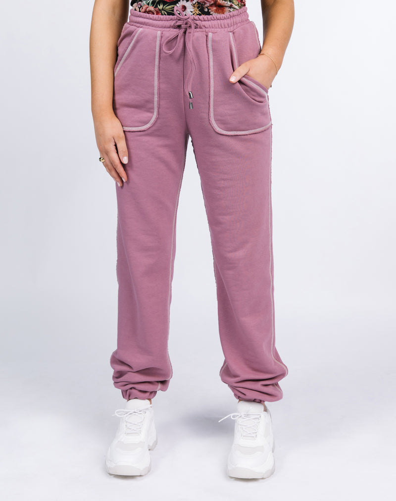 close up cropped image of the Chelsea Contrast Stitch Joggers in blush
