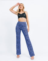 model has her hand by her head wearing a black crop with the Ariana High Waisted Trousers in Blue Cheetah