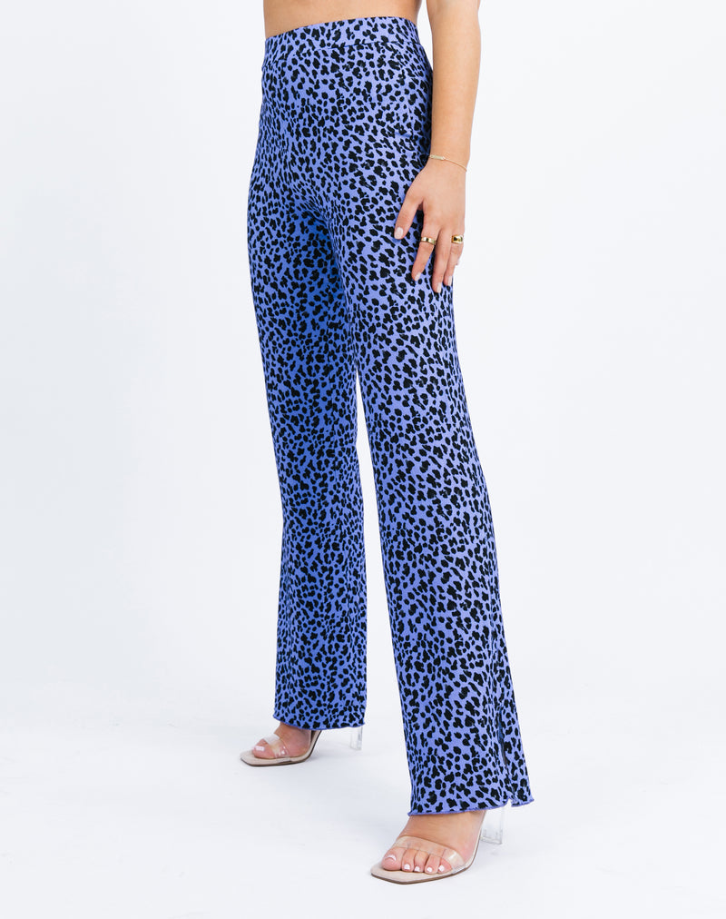 a side shot of the model wearing the Ariana High Waisted Trousers in Blue Cheetah with heels