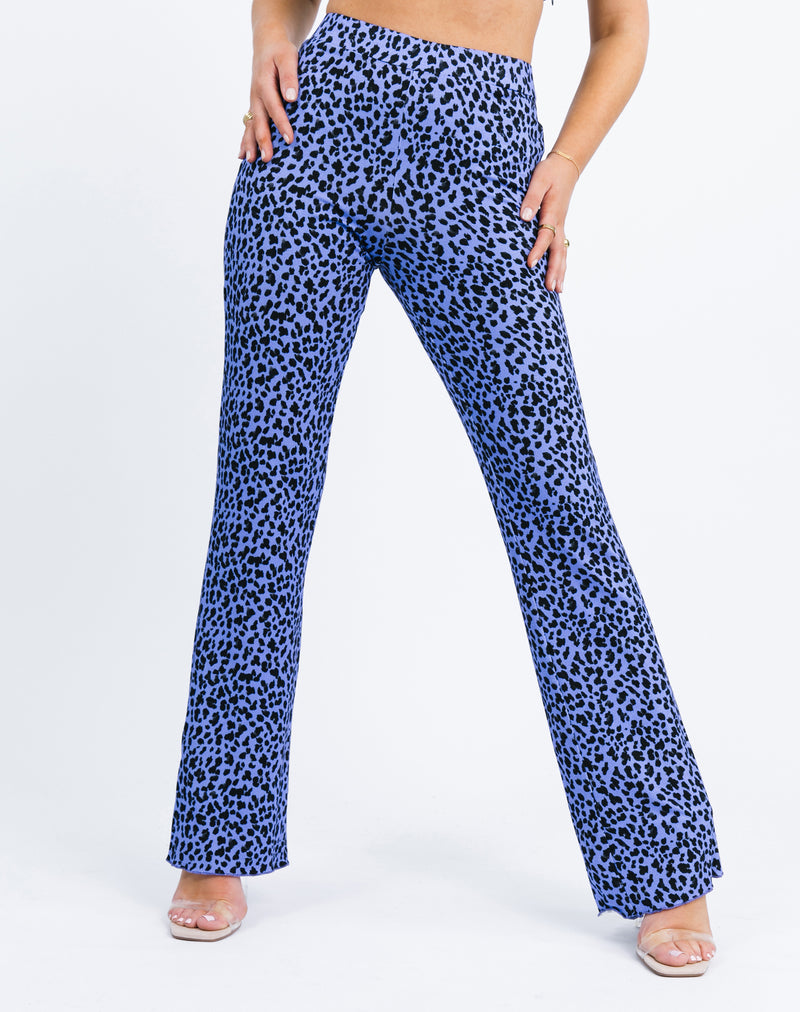 a close cropped in image of the model wearing the Ariana High Waisted Trousers in Blue Cheetah with heels