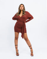 a full length image of the model in the Lotta Wrap Mini Dress In Chocolate Fluffy Rib with black tie up heels