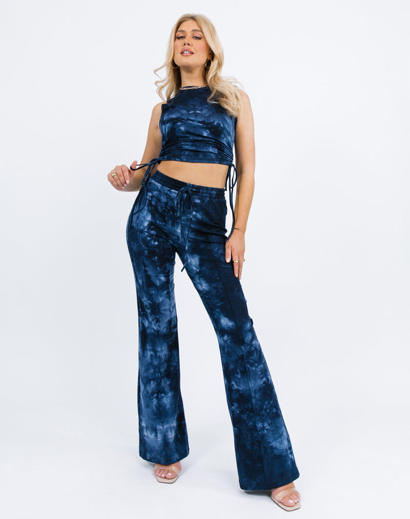 a full length image of a model wearing the Renee Blue Tie Dye Ruched Side Sleeveless Top with matching trousers