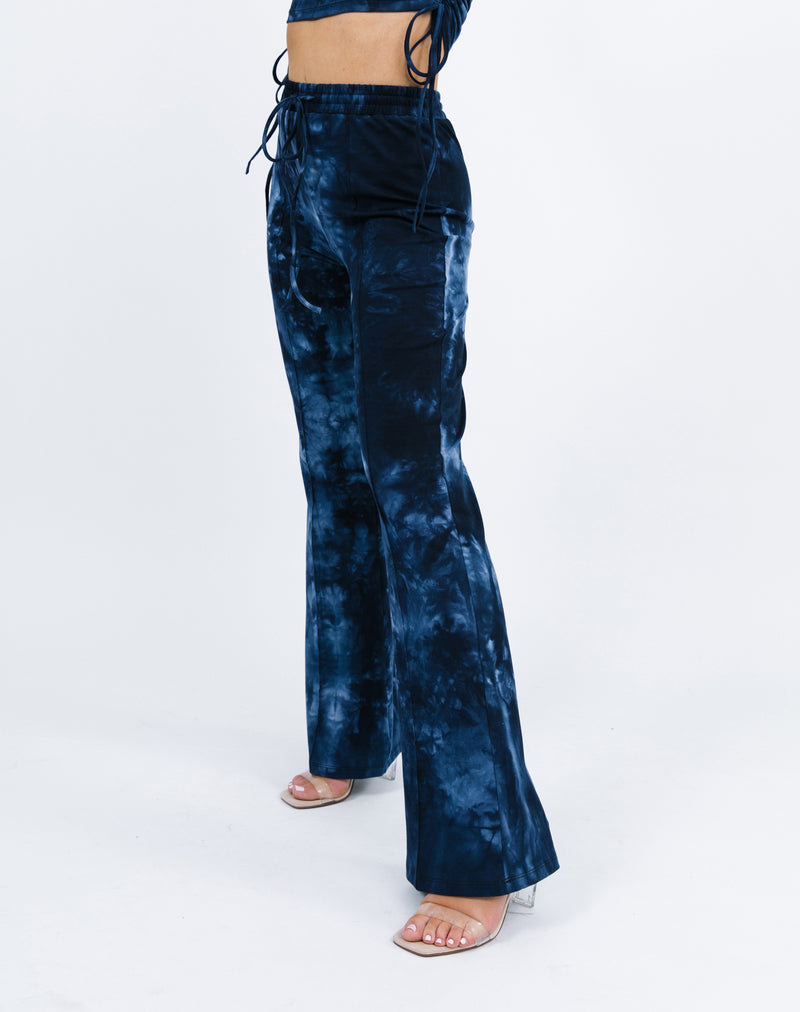 a cropped in image showing the side of the Riley Blue Tie Dye Flared Trousers