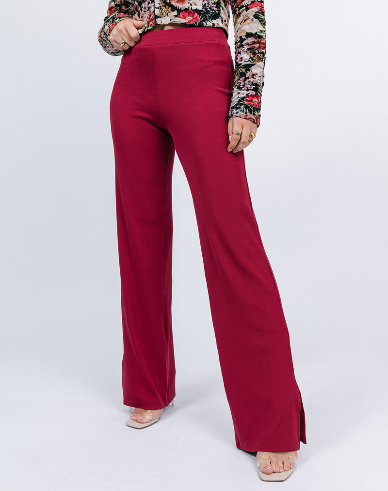 a close cropped in shot of the model wearing Lana Wide Leg Trousers in Raspberry Rib and heels