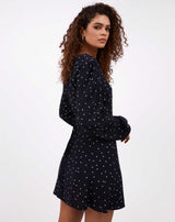 model wearing adina polka dot wrap dress back image