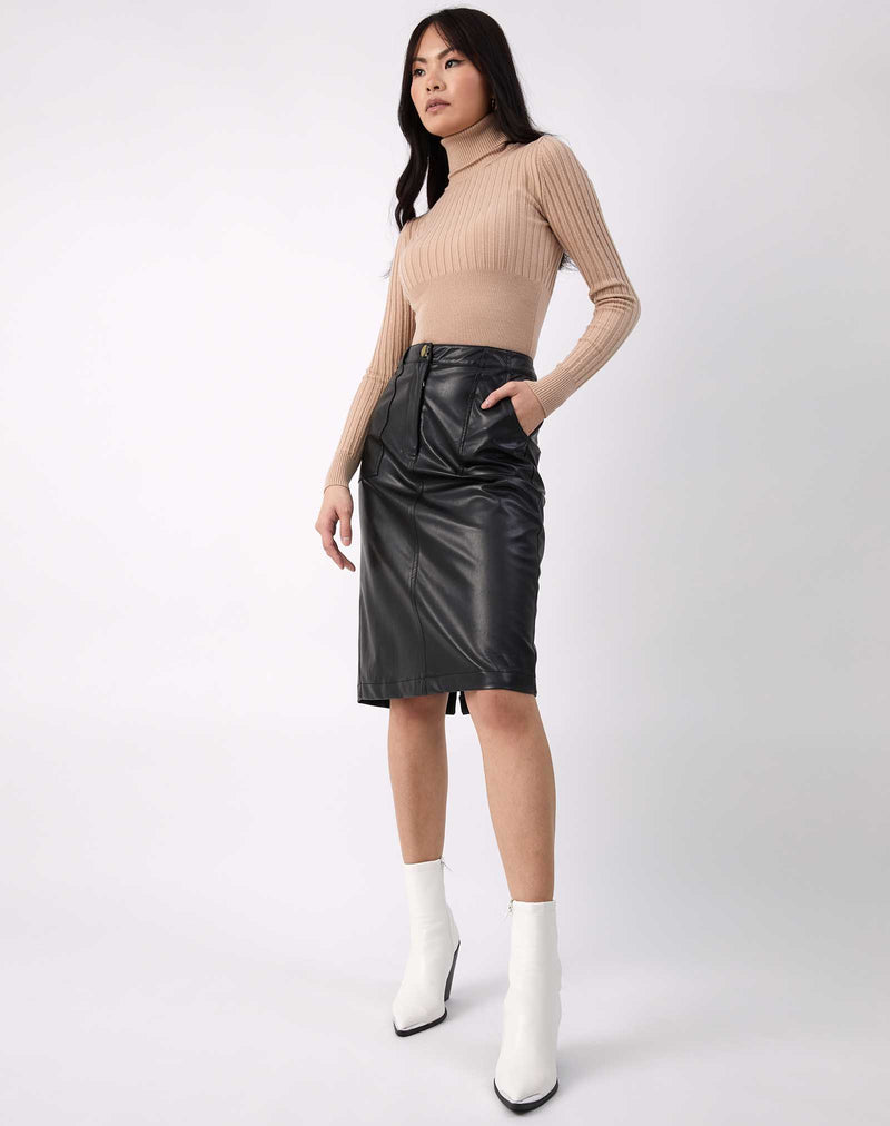 model has hands in the pocket of the Vita Black PU Midi Skirt With Pockets with a ribbed top and white boots